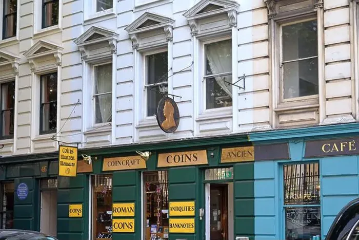 Framed Print : London, UK - Sept. 20, 2024: Coin shop in the Bloomsbury district of London Framed Print : London, UK - Sept. 20, 2024: Coin shop in the Bloomsbury district of London