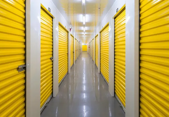 Framed Print : A long hallway containing many storage units inside a self storage building. Mississauga, Ontario, Canada Framed Print : A long hallway containing many storage units inside a self storage building. Mississauga, Ontario, Canada