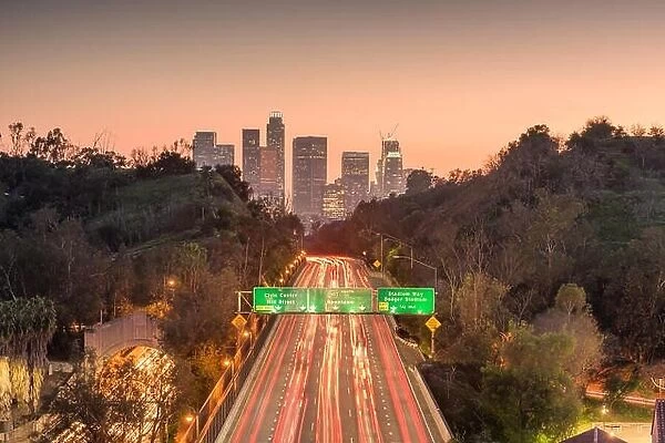Los Angeles, California, USA skyline and highway at dusk