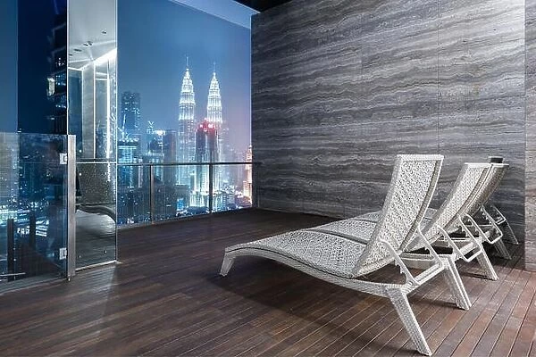 Lounge Bar on rooftop bar or rooftop highrise with great night view of Kuala Lumpur and Petronas Twin Towers in Malaysia