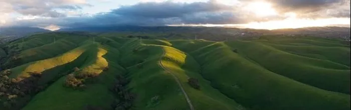 Framed Print : Low clouds drift over sunlit, grass-covered ridges in the beautiful Tri-valley region of Northern California, east of San Francisco Bay