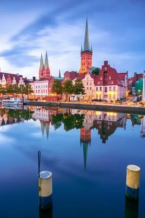 Framed Print : Lubeck, Germany. Cityscape image of riverside Lubeck with reflection of the city in Trave River at sunset Framed Print : Lubeck, Germany. Cityscape image of riverside Lubeck with reflection of the city in Trave River at sunset