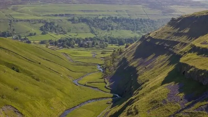 Framed Print : A lush landscape capturing the essence of Arncliffe with its meandering river through the green valley