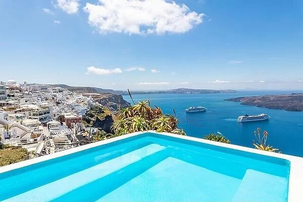 Luxury summer travel and vacation landscape. Swimming pool with sea view. White architecture on Santorini island, Greece. Beautiful landscape with sea