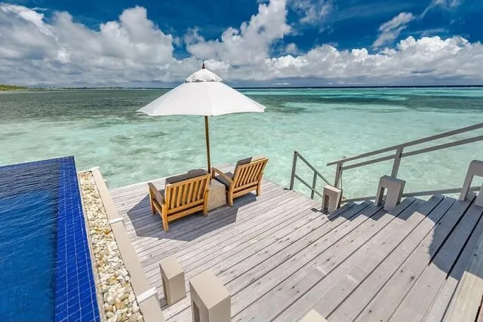 Framed Print : Luxury swimming pool in over water villa with beach chairs and umbrella. Amazing summer vibes, sea view and luxurious couple scene. Tropical paradise Framed Print : Luxury swimming pool in over water villa with beach chairs and umbrella. Amazing summer vibes, sea view and luxurious couple scene. Tropical paradise