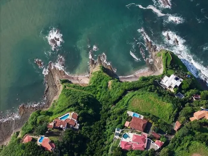 Framed Print : Luxury villas on green tropical waterfront above top drone view Framed Print : Luxury villas on green tropical waterfront above top drone view