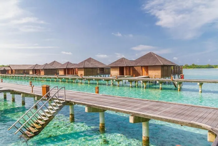 Framed Print : Luxury over water villas in Maldives, wooden jetty and blue lagoon Framed Print : Luxury over water villas in Maldives, wooden jetty and blue lagoon