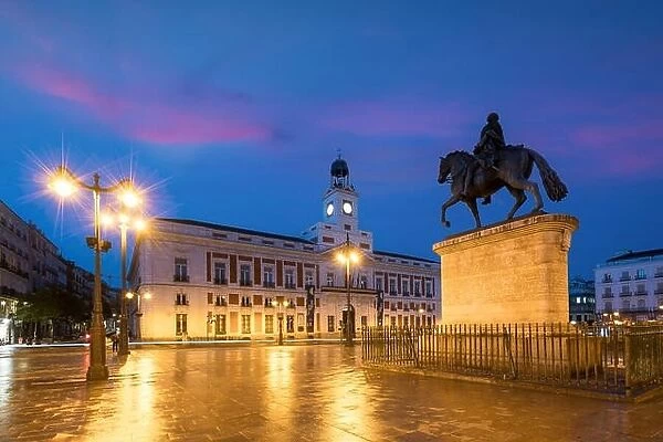 Madrid cityscape at night. Landscape of Puerta del Sol square Km 0. Historical building in Puerta del Sol square area at Madrid, Spain