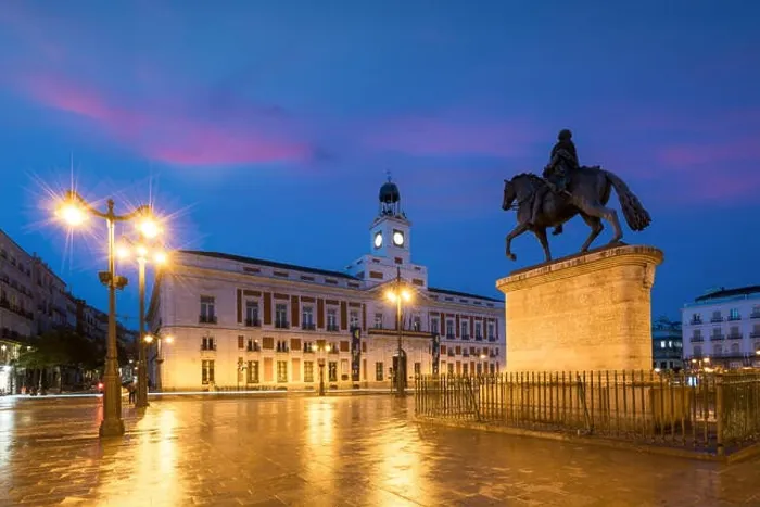 Framed Print : Madrid cityscape at night. Landscape of Puerta del Sol square Km 0. Historical building in Puerta del Sol square area at Madrid, Spain Framed Print : Madrid cityscape at night. Landscape of Puerta del Sol square Km 0. Historical building in Puerta del Sol square area at Madrid, Spain