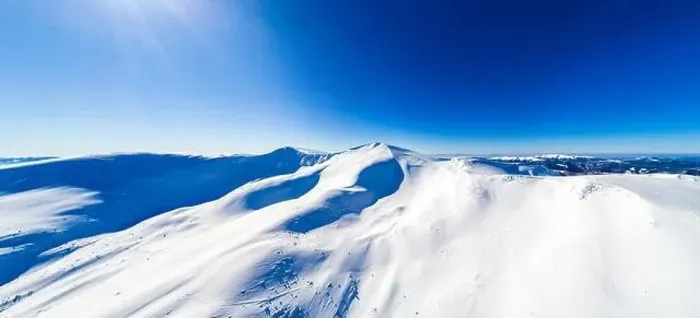 Framed Print : Magical panorama of a beautiful hill in the mountains covered by snow on the ski slope on a sunny day with a clear blue Framed Print : Magical panorama of a beautiful hill in the mountains covered by snow on the ski slope on a sunny day with a clear blue
