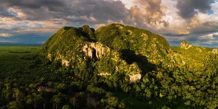 Framed Print : Magnificent aerial view of a limestone mountain with massive cave entrance Framed Print : Magnificent aerial view of a limestone mountain with massive cave entrance