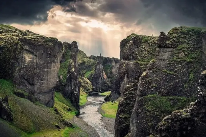 Framed Print : Majestic Fjadrargljufur canyon with river Fjadra flowing through and dramatic sky in summer at Iceland Framed Print : Majestic Fjadrargljufur canyon with river Fjadra flowing through and dramatic sky in summer at Iceland
