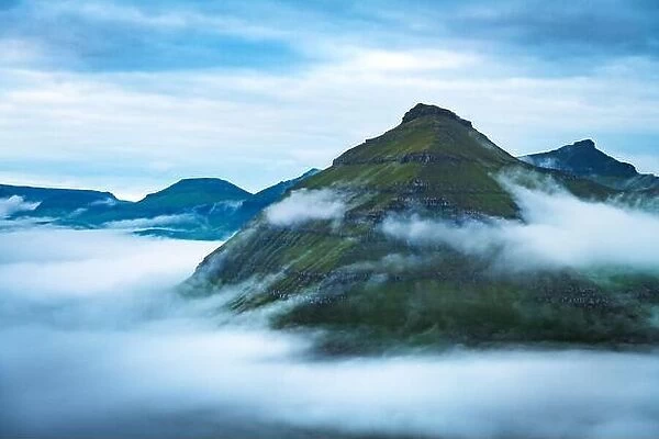 Majestic foggy views over the fjords of Funningur, Eysturoy island, Faroe Islands. Landscape photography