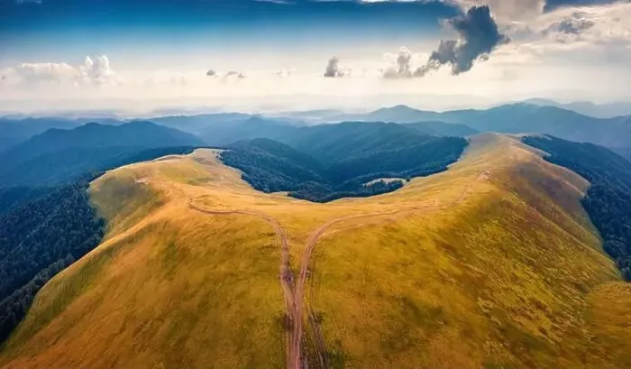 Framed Print : Majestic summer view from flying drone of Menchul mountain range with old country road Framed Print : Majestic summer view from flying drone of Menchul mountain range with old country road