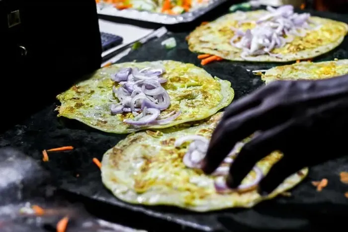 Framed Print : making of egg roll on a hot frying pan with oil and paratha and salad Framed Print : making of egg roll on a hot frying pan with oil and paratha and salad