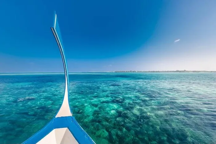 Framed Print : Maldives background with boat and tropical beach scene, blue sea and blue sky with colorful traditional Maldive boat Framed Print : Maldives background with boat and tropical beach scene, blue sea and blue sky with colorful traditional Maldive boat