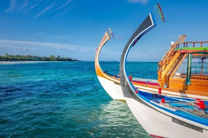 Framed Print : Maldives background with boat and tropical beach scene, blue sea and blue sky with colorful traditional Maldive boat Framed Print : Maldives background with boat and tropical beach scene, blue sea and blue sky with colorful traditional Maldive boat