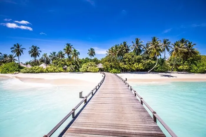 Framed Print : Maldives beach resort panoramic landscape. Tropical vacation beach. Long wooden pier, jetty into paradise island, palm trees, white sand, blue sky Framed Print : Maldives beach resort panoramic landscape. Tropical vacation beach. Long wooden pier, jetty into paradise island, palm trees, white sand, blue sky