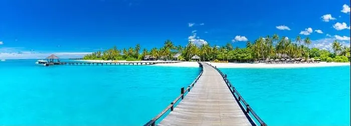 Framed Print : Maldives beach resort panoramic landscape. Long wooden pier with amazing sea beach. Tropical paradise, summer vacation, travel destination Framed Print : Maldives beach resort panoramic landscape. Long wooden pier with amazing sea beach. Tropical paradise, summer vacation, travel destination