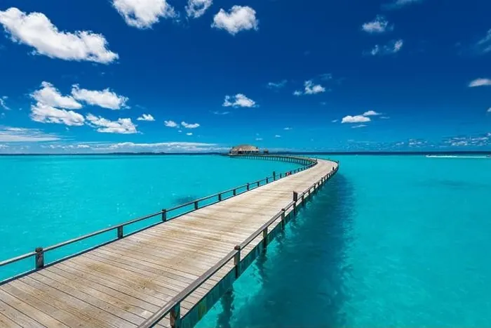 Framed Print : Maldives beach resort panoramic landscape. Long wooden pier with amazing sea beach. Tropical paradise, summer vacation, travel destination Framed Print : Maldives beach resort panoramic landscape. Long wooden pier with amazing sea beach. Tropical paradise, summer vacation, travel destination