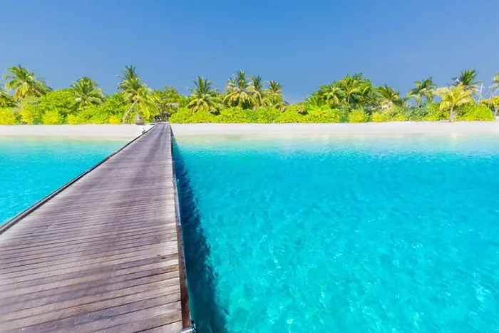Framed Print : Maldives island beach panorama. Palm trees and beach bar and long wooden pier pathway. Tropical vacation and summer holiday background concept Framed Print : Maldives island beach panorama. Palm trees and beach bar and long wooden pier pathway. Tropical vacation and summer holiday background concept