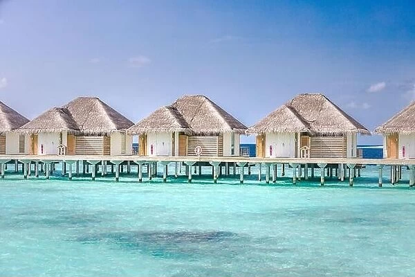 Maldives island water bungalows resort at islands beach. Indian Ocean, Beautiful landscape, luxury resort villas and jetty. Blue lagoon sea