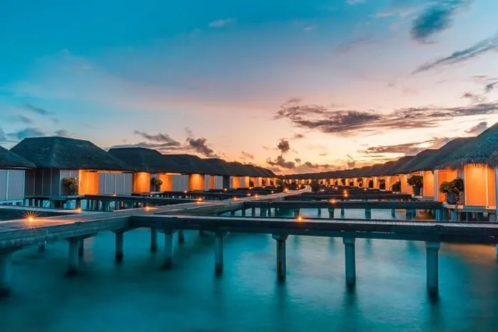 Framed Print : Maldives island and water villas. Island in ocean, overwater villas at the time sunset with led lights and twilight sky. Luxury resort, jetty bungalow Framed Print : Maldives island and water villas. Island in ocean, overwater villas at the time sunset with led lights and twilight sky. Luxury resort, jetty bungalow