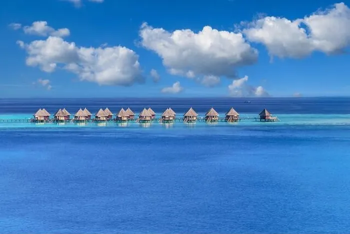 Framed Print : Maldives paradise island. Tropical aerial landscape, seascape with pier, water bungalows villas with amazing sea lagoon beach. Exotic aerial tourism Framed Print : Maldives paradise island. Tropical aerial landscape, seascape with pier, water bungalows villas with amazing sea lagoon beach. Exotic aerial tourism