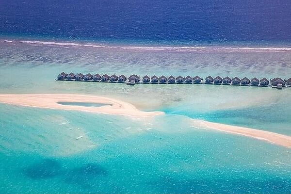 Maldives scenic paradise. Tropical aerial landscape, seascape with lagoon, sandbank, water villas with amazing sea and relax beach, tropical nature