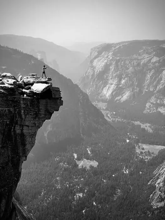 Framed Print : A male hiker taking a photo of the lower Yosemite Valley from the top of half dome Framed Print : A male hiker taking a photo of the lower Yosemite Valley from the top of half dome