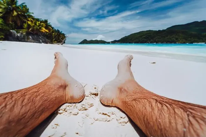 Framed Print : Male legs feet in focus. Enjoying relaxing at tropical paradise beach Framed Print : Male legs feet in focus. Enjoying relaxing at tropical paradise beach