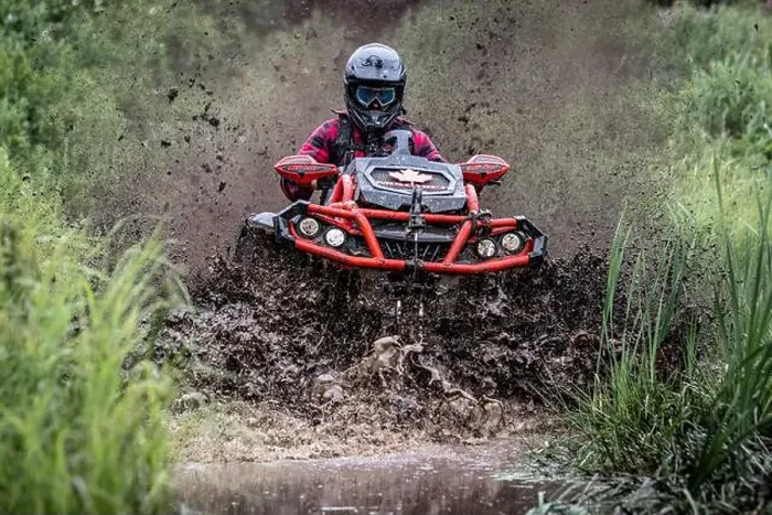 Framed Print : Man on Can-Am Outlander ATV Quad stuck in deep mud Framed Print : Man on Can-Am Outlander ATV Quad stuck in deep mud