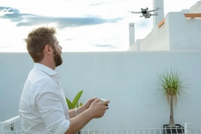 Framed Print : Man controlling drone in outdoors image with remote control Framed Print : Man controlling drone in outdoors image with remote control