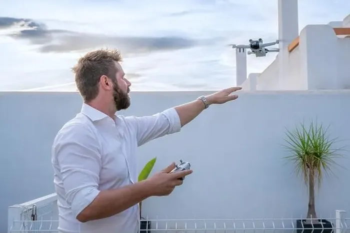 Framed Print : Man controlling drone in outdoors image with remote control Framed Print : Man controlling drone in outdoors image with remote control