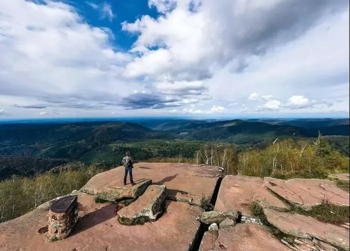 Framed Print : A man controls a drone standing on top of a cliff. Around the autumn mountain landscape. Vosges, Alsace. France Framed Print : A man controls a drone standing on top of a cliff. Around the autumn mountain landscape. Vosges, Alsace. France
