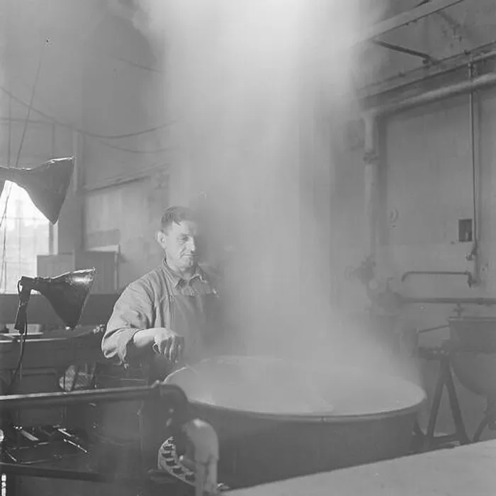 Framed Print : Man monitors the blanching of asparagus rods in a boiler Framed Print : Man monitors the blanching of asparagus rods in a boiler