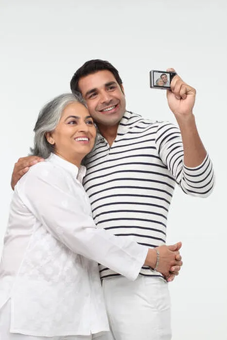 Framed Print : Man with his mother taking picture of themselves with a digital camera Framed Print : Man with his mother taking picture of themselves with a digital camera