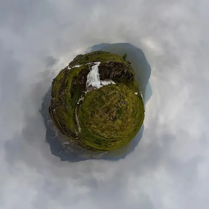 Framed Print : man in red stands under waterfall on black rock in mountains on cloudy rainy day... Tiny little planet 360 Framed Print : man in red stands under waterfall on black rock in mountains on cloudy rainy day... Tiny little planet 360