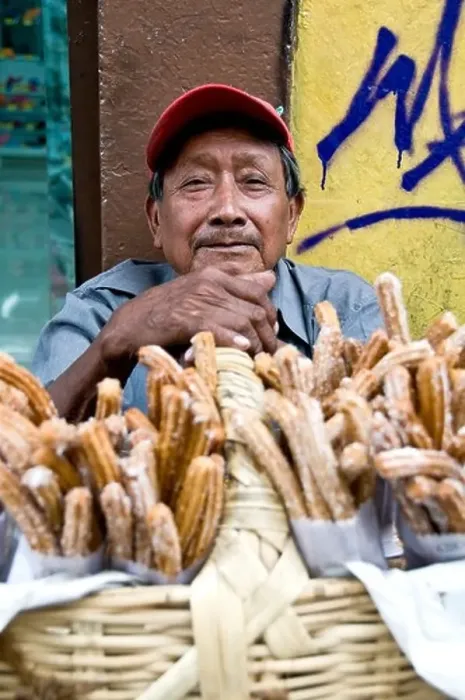 Framed Print : Man selling CHURROS on a street corner in Puebla Framed Print : Man selling CHURROS on a street corner in Puebla