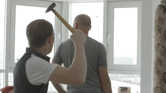 Framed Print : Man sneaks up behind to hit with a hammer. Swings a hammer to hit Framed Print : Man sneaks up behind to hit with a hammer. Swings a hammer to hit