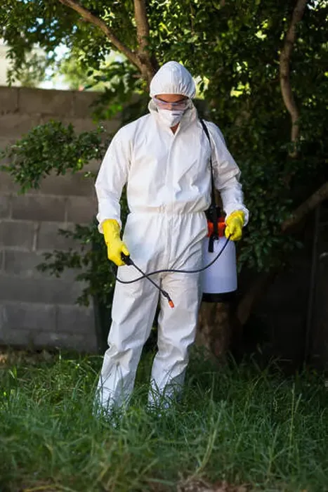 Framed Print : Man spraying pesticide on grass Framed Print : Man spraying pesticide on grass