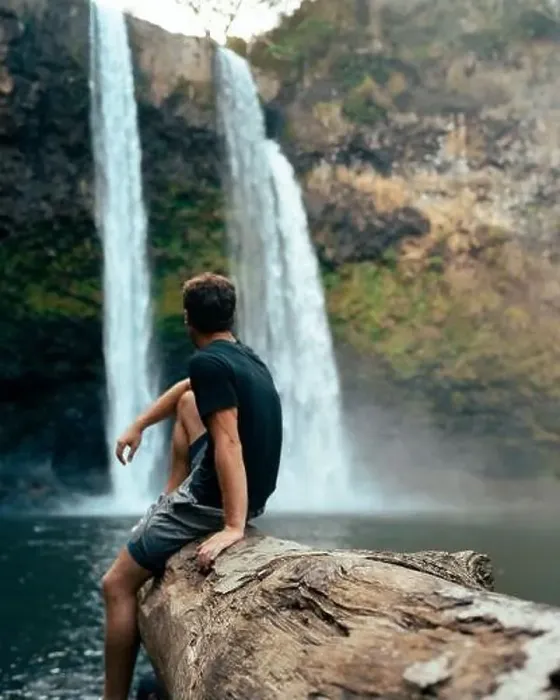 Framed Print : Man standing in front of Wailua Waterfall on Kauai Framed Print : Man standing in front of Wailua Waterfall on Kauai