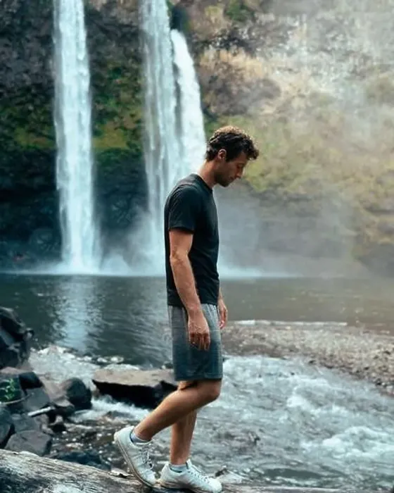 Framed Print : Man standing in front of Wailua Waterfall on Kauai Framed Print : Man standing in front of Wailua Waterfall on Kauai