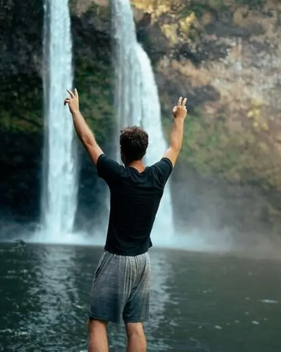 Framed Print : Man standing in front of Wailua Waterfall on Kauai Framed Print : Man standing in front of Wailua Waterfall on Kauai