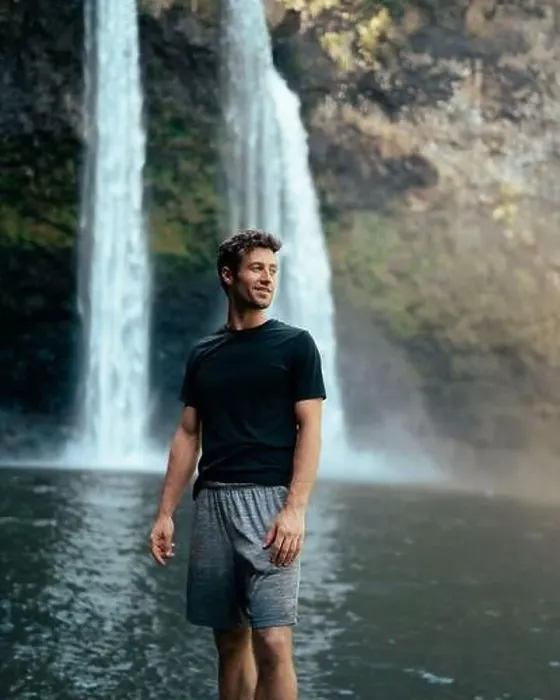 Framed Print : Man standing in front of Wailua Waterfall on Kauai Framed Print : Man standing in front of Wailua Waterfall on Kauai