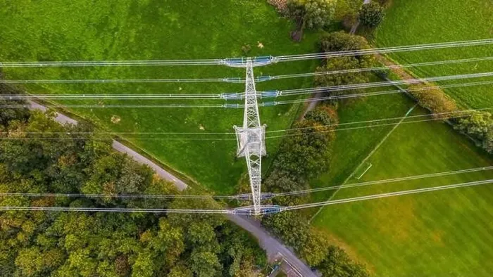 Framed Print : A man made steel tower with power lines in the middle of nature, trees and meadows in Germany Framed Print : A man made steel tower with power lines in the middle of nature, trees and meadows in Germany