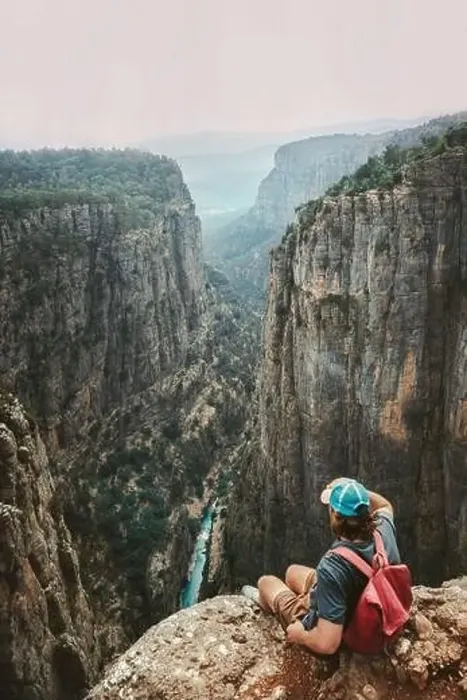 Framed Print : Man traveler sitting alone on cliff edge hiking with backpack travel healthy lifestyle active vacations outdoor hiker Framed Print : Man traveler sitting alone on cliff edge hiking with backpack travel healthy lifestyle active vacations outdoor hiker