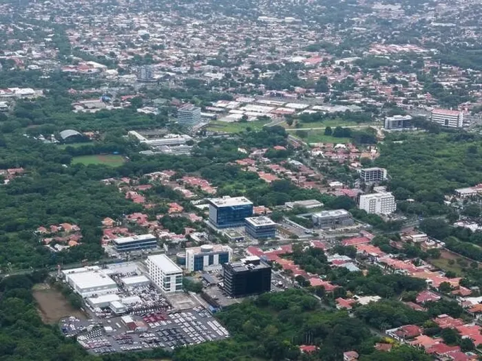 Framed Print : Managua, Nicaragua - August 14, 2024: Office building in Managua city aerial drone view Framed Print : Managua, Nicaragua - August 14, 2024: Office building in Managua city aerial drone view