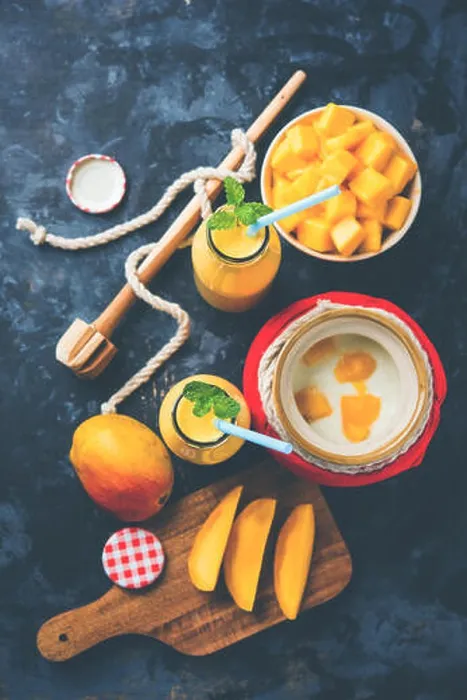 Framed Print : Mango Lassi or smoothie in big glass or small bottles with curd Framed Print : Mango Lassi or smoothie in big glass or small bottles with curd