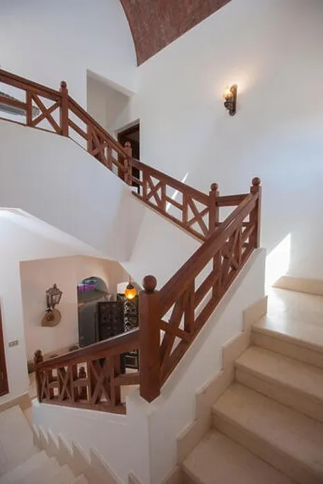 Framed Print : Marble curved staircase from ground floor to upstairs in luxury holiday villa with wooden bannister railing Framed Print : Marble curved staircase from ground floor to upstairs in luxury holiday villa with wooden bannister railing